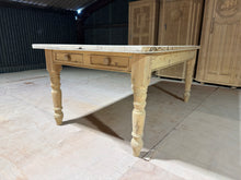 Load image into Gallery viewer, A striking vintage pine dining table with authentic character and generous proportions. Stripped back to natural wood, this piece showcases the grain and patina of age—a light wax finish will enhance protection and lustre. Two front drawers provide practical storage for linens or cutlery. Sturdy fixed legs ensure stability. Comfortably seats 6–8 diners, making it an ideal centrepiece for country kitchens and period homes seeking genuine vintage appeal.
Delivery Available
Overall Dimensions
185cm long x 1