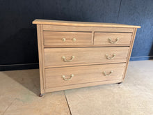Load image into Gallery viewer, A beautiful satinwood chest of drawers, stripped to reveal its natural grain and character. Features four dovetail-jointed drawers—two short and two long—offering versatile storage. The piece sits on castors for easy repositioning. In its stripped state, the wood may benefit from a protective coat of wax to enhance durability and finish. Shows honest signs of age including minor marks and one missing handle, adding to its authentic vintage appeal. Ideal for those seeking genuine period furniture with charac