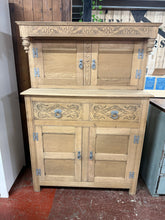 Load image into Gallery viewer, This solid oak chiffonier combines classic design with practical storage. Stripped to bare wood and structurally sound, it features two spacious double cupboards and two dovetail-jointed drawers for generous organisation. The natural finish invites personalisation—consider applying wax for enhanced protection and warmth. A versatile statement piece that brings character and functionality to any interior.
Delivery Available
Overall Dimensions
107cm wide x 48cm deep x 153.5cm high
