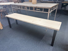 Load image into Gallery viewer, This charming industrial-style wooden dining bench is sturdy and well-maintained. It features a raw finish that would benefit from a protective wax. Plus, the removable legs make it easy to move around.
Overall Dimensions
174cm long x 42cm wide x 48cm high
DELIVERY AVAILABLE      
For our other items see our website https://fossewayfurniture.co.uk
collection from our shop at cv36, our collection zone at bs36 or otherwise delivery is available