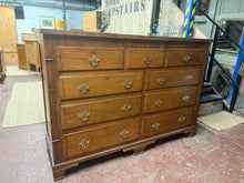 Load image into Gallery viewer, This exquisite and unique mahogany dresser features a concealed storage area at the top, offering generous room for items. The top three drawers are faux, hiding the storage box behind. In addition, there are 6 long drawers with dovetail joints for added storage. Despite being pre-owned, this piece only has minor cosmetic imperfections and remains structurally sound.
Overall Dimensions
171cm wide x 56cm deep x 120cm high
DELIVERY AVAILABLE    
For our other items see our website https://fossewayfurnitur