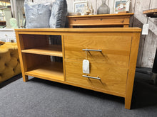 Load image into Gallery viewer, Handcrafted oak TV unit featuring solid construction and timeless design. Two dovetail-jointed drawers provide secure storage for remotes, media, and accessories, while an open shelf offers flexible display space. Built by Oak Furniture Land. Light wear from use adds character without compromising function or durability.
Delivery Available
Overall Dimensions
115cm wide x 47.5cm deep x 60cm high