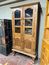 Load image into Gallery viewer, This beautiful hardwood display unit is sturdy and well-maintained. While it shows some signs of use, the marks are minor. It provides generous storage space with two shelves at the top and one at the bottom. Both doors can be locked, and it includes the original key for added security.
Overall Dimensions
98cm wide x 39cm deep x 188cm high
DELIVERY AVAILABLE      
For our other items see our website https://fossewayfurniture.co.uk
collection from our shop at cv36, our collection zone at bs36 or otherwi