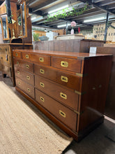 Load image into Gallery viewer, Stunning 19th century yew wood chest of drawers featuring exceptional craftsmanship with dovetail-jointed construction. This structurally sound piece offers generous storage across ten drawers—four shallow and six deep—making it ideal for any bedroom or hallway. The rich grain and warm tones of yew wood create a striking focal point in period or contemporary interiors. Minor cosmetic wear including surface scratches and missing handles add to its character and can be easily restored.
Delivery Availab