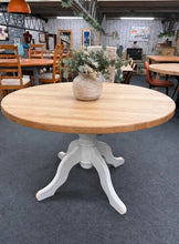 Load image into Gallery viewer, Classic oak round table with timeless appeal. Structurally sound and in good working condition. Features a removable top for convenient transport and reconfiguration. Accommodates 4–6 diners comfortably. Shows minor surface marks consistent with age and use; legs may benefit from refinishing to suit your décor. Ideal for families seeking practical, durable dining furniture with character.
Delivery Available
Overall Dimensions
121.5cm diameter x 76.5cm high