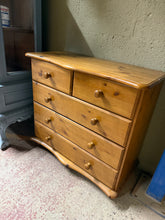 Load image into Gallery viewer, A charming solid pine chest of drawers which is structurally sound and in good condition, featuring two short dovetail-jointed drawers above three spacious long drawers—ideal for bedroom or living room storage. Light surface marks add to its vintage appeal.
Delivery Available
Overall Dimensions
84cm wide x 40cm deep x 79cm high