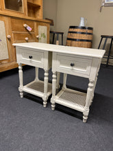 Load image into Gallery viewer, A charming pair of white French-style bedside tables, each featuring a practical drawer and lower shelf for convenient storage. These pieces showcase classic design elements and remain in solid working condition. Minor surface marks add to their authentic character, making them ideal for vintage-inspired or eclectic interiors.
Delivery Available
Overall Dimensions
40cm wide x 35cm deep x 61.5cm high 