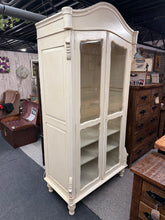 Load image into Gallery viewer, This charming cream distressed armoire combines vintage character with practical storage. Structurally sound and in excellent condition, it features one hanging rail and two adjustable, removable shelves—ideal for clothing, linens, or display. Light surface marks add to its authentic French-inspired aesthetic. Perfect for those seeking timeless, elegant furniture with genuine appeal.
Delivery Available
Overall Dimensions
100cm wide x 54cm deep x 200cm high