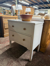 Load image into Gallery viewer, Vintage painted wooden chest of drawers featuring two spacious storage drawers. Finished in a gloss paint with marks that add to its charm. A functional piece perfect for bedrooms, hallways, or living spaces seeking personality and practical storage solutions.
Delivery Available
Overall Dimensions
69.5cm wide x 43cm deep x 76.5cm + 6cm high