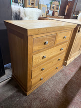 Load image into Gallery viewer, This elegant light oak chest of drawers combines practical storage with contemporary design. Featuring two short drawers above three spacious long drawers, it offers versatile organisation for any room. Crafted from quality oak, the piece is structurally sound and in good overall condition. Minor surface marks are present to the top but nothing too major.
Delivery Available
Overall Dimensions
95cm wide x 45cm deep x 89cm high 