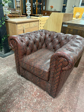 Load image into Gallery viewer, This distinctive snakeskin print leather armchair combines bold style with practical comfort. Structurally sound and well-maintained, it bears the gentle patina of gentle use—minor surface marks that add character rather than detract from its appeal. A striking statement piece that brings personality and warmth to any living room.
Delivery Available
Overall Dimensions
approx : 94cm wide x 87cm deep x 72cm high 