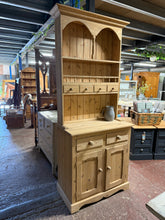Load image into Gallery viewer, This stunning tall solid pine dresser has been completely stripped back to its natural untainted self so may need a coat of wax for protection. It has ample storage with 4 drawers and 2 shelves in the top section above 2 dovetail jointed drawers and a double cupboard. This does come into 2 for easier moving.
Overall Dimensions
84cm wide x 45cm deep x 206cm high
DELIVERY AVAILABLE    
For our other items see our website https://fossewayfurniture.co.uk
collection from cv36 or bs36