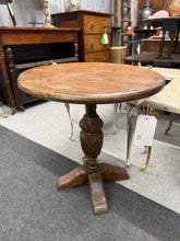 Load image into Gallery viewer, This charming early 20th century oak side table combines timeless elegance with sturdy craftsmanship. Perfect for holding your favourite lamp, books, or tea, this side table brings both style and function to your living space. 
Delivery Available
Overall Dimensions
49cm diameter x 52cm high
Split the cost over 3 months with KLARNA when you spend £50 or more          
All our items are second hand so may have a few marks,knocks ,chips etc that aren't clearly seen in the ph