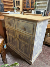 Load image into Gallery viewer, Bring character and charm to your dining space with this striking solid pine sideboard, beautifully finished in soft lilac and crisp white with a distressed aesthetic. Featuring thoughtfully designed storage, it combines two expertly crafted dovetail jointed drawers with a spacious double cupboard below—perfect for keeping tableware, linens, and entertaining essentials neatly organised and within easy reach.
Overall Dimensions
87cm wide x 49cm deep x 84cm high
DELIVERY AVAILABLE
For our other item