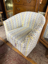 Load image into Gallery viewer, This charming tub chair brings comfort and character to any room. Featuring a vibrant colour palette, it's ideal for creating a cosy reading nook or adding personality to a bedroom. While it shows minor cosmetic wear consistent with pre-loved furniture, it remains in solid working condition and offers excellent value for those seeking a statement piece without the premium price tag.
Delivery Available
Overall Dimensions
approx : 73cm wide x 65cm deep x 77cm high