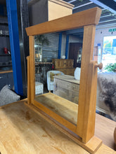 Load image into Gallery viewer, A charming light oak dressing table mirror with authentic character. Structurally sound and in good overall condition, this piece displays gentle patina from years of use. Ideal for adding warmth and timeless appeal to any bedroom or dressing space.
Delivery Available
Overall Dimensions
75cm wide x 10cm deep x 70cm high 