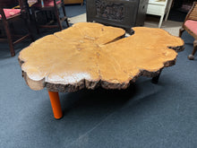 Load image into Gallery viewer, This beautiful live edge coffee table is solidly built and well-maintained, showing just a few small marks. It features two black legs and one orange leg, which can be removed for easier transport. This unique piece is sure to catch everyone’s eye and start conversations.
Overall Dimensions
approx : 126cm x 104cm x 47cm high
DELIVERY AVAILABLE
For our other items see our website https://fossewayfurniture.co.uk
collection from our shop at cv36, our collection zone at bs36 or otherwise delivery is