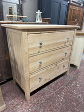 Load image into Gallery viewer, A beautiful stripped pine chest featuring three spacious long drawers, perfect for bedroom or living room storage. Returned to its natural wood finish, this piece showcases the authentic grain and character of quality pine. In excellent condition with minimal wear, it's ready to be finished to your preference—a protective coat of wax or oil will enhance both appearance and durability. An ideal choice for those seeking furniture with timeless appeal.
Delivery Available
Overall Dimensions
110cm wide x 51cm