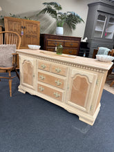 Load image into Gallery viewer, A beautiful mahogany sideboard, stripped to reveal its natural grain and warm tones. This piece offers generous storage across two cupboards and three deep drawers—ideal for dining rooms or living spaces. Structurally sound and ready to finish. Consider applying wax or oil to protect the wood and enhance its character.
Overall Dimensions
143cm wide x 44cm deep x 77.5cm high
DELIVERY AVAILABLE
For our other items see our website https://fossewayfurniture.co.uk
Collection from our shop at CV36 4QZ
