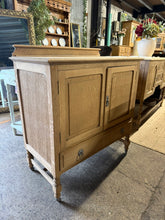 Load image into Gallery viewer, Stunning stripped oak cupboard showcasing natural wood grain and character. Features a double cupboard and a spacious dovetail-jointed drawer, offering practical storage with timeless appeal. The bare wood finish reveals the quality craftsmanship and allows you to customize the look with your choice of stain or wax. Structurally sound and ready to become a cherished piece in your home.
Delivery Available
Overall Dimensions
91cm wide x 47cm deep x 90/98cm high
