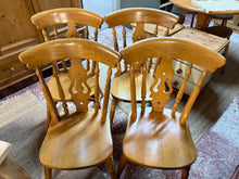 Load image into Gallery viewer, A charming set of four solid pine farmhouse chairs, each structurally sound and ready for everyday use. These characterful pieces bear the gentle patina of age with minor surface marks that add to their rustic appeal. Ideal for creating an authentic country aesthetic in your dining space or kitchen, they bring warmth and traditional style to any home.
Delivery Available
Overall Dimensions
approx : 41cm wide x 40cm deep x 90cm high