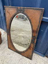 Load image into Gallery viewer, This beautiful leather mirror features bevelled edges and remains structurally stable. While it shows some signs of use with a few leather cracks, these do not impact its functionality.
Delivery Available
Overall Dimensions
59cm wide x 90cm high