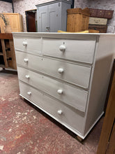 Load image into Gallery viewer, A beautiful mahogany chest of drawers reimagined with crisp white paintwork, this piece combines classic craftsmanship with contemporary style. Featuring two petite dovetail-jointed drawers above three generous storage drawers, it offers excellent capacity for any room. Perfect for those seeking quality furniture with timeless appeal and practical storage solutions. It has a few minor marks but this just adds to the charm.
Overall Dimensions
115cm wide x 53cm deep x 101cm high
DELIVERY AVAILABLE
F