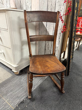Load image into Gallery viewer, A charming elm and beech rocking chair that combines timeless appeal with practical comfort. While showing its age with minor surface marks, this piece remains structurally robust and ready for everyday use. Ideal for creating a cosy fireside retreat or adding character to any room, it offers authentic vintage character without requiring restoration work.
Delivery Available
Overall Dimensions
approx : 43cm wide x 53cm deep x 87cm high