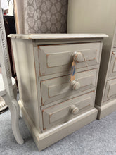 Load image into Gallery viewer, Available to view in store
Charming solid pine bedside table finished in soft greige with subtle distressing for vintage character. Features three dovetail-jointed drawers offering practical storage space. Structurally sound and in excellent condition, ready to complement any bedroom scheme.
Delivery Available
Overall Dimensions
44cm wide x 40cm deep x 57cm high
Split the cost over 3 months with KLARNA when you spend £50 or more
All our items are second hand s