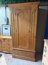 Load image into Gallery viewer, This charming vintage pine wardrobe combines timeless style with practical storage. Structurally sound and in good overall condition, it bears the gentle patina of age with only minor marks that add to its character. Features one hanging rail for garments and a spacious dovetail-jointed drawer for additional storage. Designed to separate into two sections for convenient transport and placement. A wonderful addition to any bedroom or dressing space seeking authentic vintage appeal.
Delivery Available
Overa