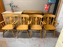 Load image into Gallery viewer, This charming set of 4 solid pine carver chairs offers both durability and timeless style. Each chair is structurally sound, ensuring safe and comfortable seating for your dining area. While they are pre-loved and show some gentle signs of use, the marks are minor and add character without detracting from their overall good condition.
Overall Dimensions
approx : 58cm wide x 44cm deep x 92cm high
DELIVERY AVAILABLE      
For our other items see our website https://fossewayfurniture.co.uk
collection from