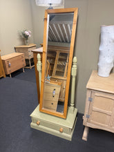 Load image into Gallery viewer, A charming two-tone solid pine mirror with authentic character. Structurally sound and well-maintained, this freestanding piece features a dovetail-jointed drawer at the base for practical storage. The mirror detaches from its frame, making transport and repositioning effortless. Perfect for bedrooms or dressing areas seeking vintage appeal with functional design.
Delivery Available
Overall Dimensions
61.5cm wide x 37cm deep x 155cm high