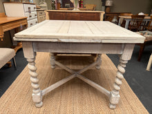 Load image into Gallery viewer, A characterful oak extendable table with a weathered limed finish. The extension mechanism needs some TLC. Expands to comfortably seat 6–8 guests, making it ideal for dining rooms that need flexible space. The limed surface shows gentle patina from previous use, adding authentic vintage charm. Perfect for those who appreciate period furniture with genuine character and history.
Delivery Available
Overall Dimensions
91cm wide x 91cm deep x 75cm high
extra 60cm deep when extended