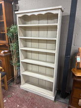 Load image into Gallery viewer, This charming solid pine bookcase features a beautiful white paint finish with a delightful distressed look, added by its previous owner. Offering plenty of storage space, it includes 5 fixed shelves perfect for organising your books and treasures.
Overall Dimensions
93cm wide x 27cm deep x 182cm high
DELIVERY AVAILABLE      
For our other items see our website https://fossewayfurniture.co.uk
collection from our shop at CV36 4QZ or purchase online for delivery.