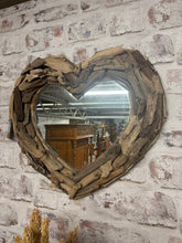 Load image into Gallery viewer, This charming driftwood heart mirror is sturdy and well-maintained. Its robust, rustic frame will bring a warm and welcoming touch to any room.
Delivery Available
Overall Dimensions
approx : 60c wide x 55cm high     