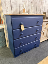 Load image into Gallery viewer, Discover the charm of this striking blue chest of drawers, crafted from solid pine and finished with a rich, deep blue paint that brings character to any room. The natural oak-waxed top adds warmth and contrast, while four spacious drawers provide ample storage for your belongings.
Delivery Available
Overall Dimensions
74cm wide x 38cm deep x 82.5cm high