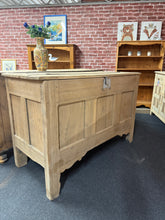 Load image into Gallery viewer, This handsome large oak coffer showcases the character of authentic vintage furniture. Stripped back to reveal natural wood grain, it bears gentle patina marks that speak to its history and charm. The lift-top design provides generous storage, making it both a striking focal point and a practical addition to any room. A light wax finish will enhance and protect the wood. Perfect for living spaces, bedrooms, or hallways where storage meets style.
Delivery Available
Overall Dimensions
131cm wide x 59cm dee