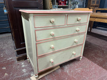 Load image into Gallery viewer, This charming solid pine chest of drawers offers generous storage space with two short dovetail jointed drawers above three longer ones, perfect for organising your belongings neatly. Previously painted, it carries a cozy, lived-in character and would brighten up beautifully with a fresh coat of paint to perfectly match your style. Crafted from durable pine, this piece combines practical storage with timeless appeal.
Overall Dimensions
95cm wide x 49cm deep x 88.5cm high
DELIVERY AVAILABLE      
HAVE TH