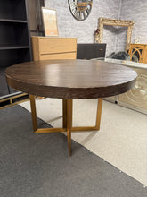 Load image into Gallery viewer, Bring glamour to your dining space with this charming Art Deco round table. Featuring distinctive gold metal legs that detach for convenient transport. While the surface shows character marks, a fresh coat of paint will restore it to showroom condition. Comfortably seats six guests, making it perfect for dinner parties and family gatherings.
Delivery Available
Overall Dimensions
120cm diameter x 77.5cm high 