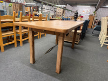 Load image into Gallery viewer, A charming rustic pine dining table crafted from solid wood, built to last. The removable top makes transport and rearrangement effortless, whilst the convenient front drawer provides practical storage for table linens or dining essentials. This well-loved piece bears the authentic character of age and use, with minor marks that add to its rustic appeal. Structurally sound and ready to become the centrepiece of your dining space.
Delivery Available
Overall Dimensions
183cm long x 92cm wide x 82cm high&nb