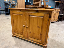 Load image into Gallery viewer, A sturdy low pine cupboard built from solid pine that's ready for use or restoration. The surface shows honest wear and patina, presenting an opportunity to refinish through sanding or painting to suit your taste. One internal shelf provides practical storage space.
Delivery Available
Overall Dimensions
91cm wide x 44cm deep x 70cm high 