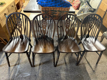 Load image into Gallery viewer, A beautiful quartet of oak wheelback dining chairs ready to enhance your dining space. Each piece boasts solid construction and maintains good overall condition, with only minor cosmetic marks that add character rather than detract from their appeal. Perfect for those seeking authentic, timeless seating with genuine charm and durability.
Overall Dimensions
approx : 38cm wide x 47cm deep x 88.5cm high
DELIVERY AVAILABLE
HAVE THIS PAINTED A COLOUR OF YOUR CHOICE FOR AN EXTRA £120 OR HAVE IT COMPLETE