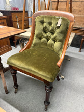 Load image into Gallery viewer, This elegant mid-19th century mahogany show frame chair features rich green velour upholstery and solid structural integrity. Authentically aged with gentle patina befitting its period, it remains in good overall condition with minor surface marks consistent with vintage furniture. The graceful frame and comfortable proportions make it an ideal accent piece for a bedroom, study, or living space seeking character and timeless appeal.
Delivery Available
Overall Dimensions
approx : 53cm wide x 50cm deep x 9