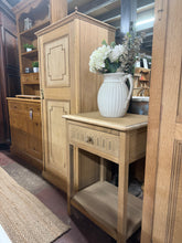 Load image into Gallery viewer, A charming oak side table with authentic period character. Structurally sound and in good overall condition, this piece has been stripped back to bare wood, revealing its natural beauty—a light coat of wax will enhance and protect the finish. Features a dovetail-jointed drawer and lower shelf for practical storage. Minor surface marks add to its vintage appeal. Perfect for adding warmth and functionality to any room.
Delivery Available
Overall Dimensions
54.5cm wide x 43cm deep x 75.5cm high
