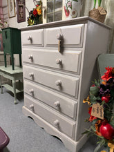 Load image into Gallery viewer, A charming solid pine chest of drawers, finished in soft grey with a gently distressed surface that adds character and vintage appeal. The practical 2-over-4 drawer configuration offers ample storage for bedroom essentials or living spaces. Well-maintained with only minor signs of use, this piece combines functionality with understated elegance.
Delivery Available
Overall Dimensions
92cm wide x 50cm deep x 117cm high
