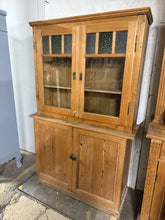 Load image into Gallery viewer, This charming vintage pine dresser is solidly built and well-preserved for its age. It features two shelves inside the top section and two more in the base, offering plenty of storage space. The top separates from the base for convenient handling. Bring a touch of rustic country warmth into your home with this delightful piece.
Overall Dimensions
107cm wide x 34cm deep x 168cm high
DELIVERY AVAILABLE      
For our other items see our website https://fossewayfurniture.co.uk
collection from our shop at c