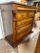Load image into Gallery viewer, This beautiful large Victorian mahogany chest of drawers is solidly built and well-preserved for its age. While it’s missing some trim, this can be easily replaced. It features two short dovetail-jointed drawers above three longer ones, providing ample storage space. Plus, there’s a hidden secret drawer at the top for added charm.
Overall Dimensions
129cm wide x 55cm deep x 117cm high
DELIVERY AVAILABLE
For our other items see our website https://fossewayfurniture.co.uk
collection from our shop a