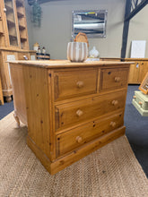 Load image into Gallery viewer, A charming solid pine chest of drawers with authentic period character. Structurally sound and built to last, it features two short dovetail-jointed drawers over two generously proportioned long drawers—ideal for bedroom storage or hallway display. The natural finish and subtle marks reflect its vintage heritage, making it perfect for country, rustic, or traditional interiors. Timeless craftsmanship that adds warmth and storage to any home.
Delivery Available
Overall Dimensions
94cm wide x 46cm deep x 77