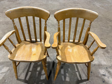 Load image into Gallery viewer, A matching pair of solid pine carver chairs offering sturdy seating with authentic character. Both pieces are in sound working order, displaying the natural patina of age with minor surface marks that add to their charm. Ideal for dining settings or bedroom spaces, these well-crafted chairs combine practicality with timeless appeal.
Delivery Available
Overall Dimensions
approx : 59cm wide x 44cm deep x 92cm high