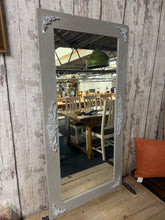 Load image into Gallery viewer, Elegant grey mirror featuring subtle ornate detailing that brings refined character to any room. This pre-loved piece is structurally sound with minor surface marks that reflect its authentic history. Perfect for adding dimension and light to hallways, bedrooms, or living spaces.
Delivery Available
Overall Dimensions
59cm wide x 118.5cm high